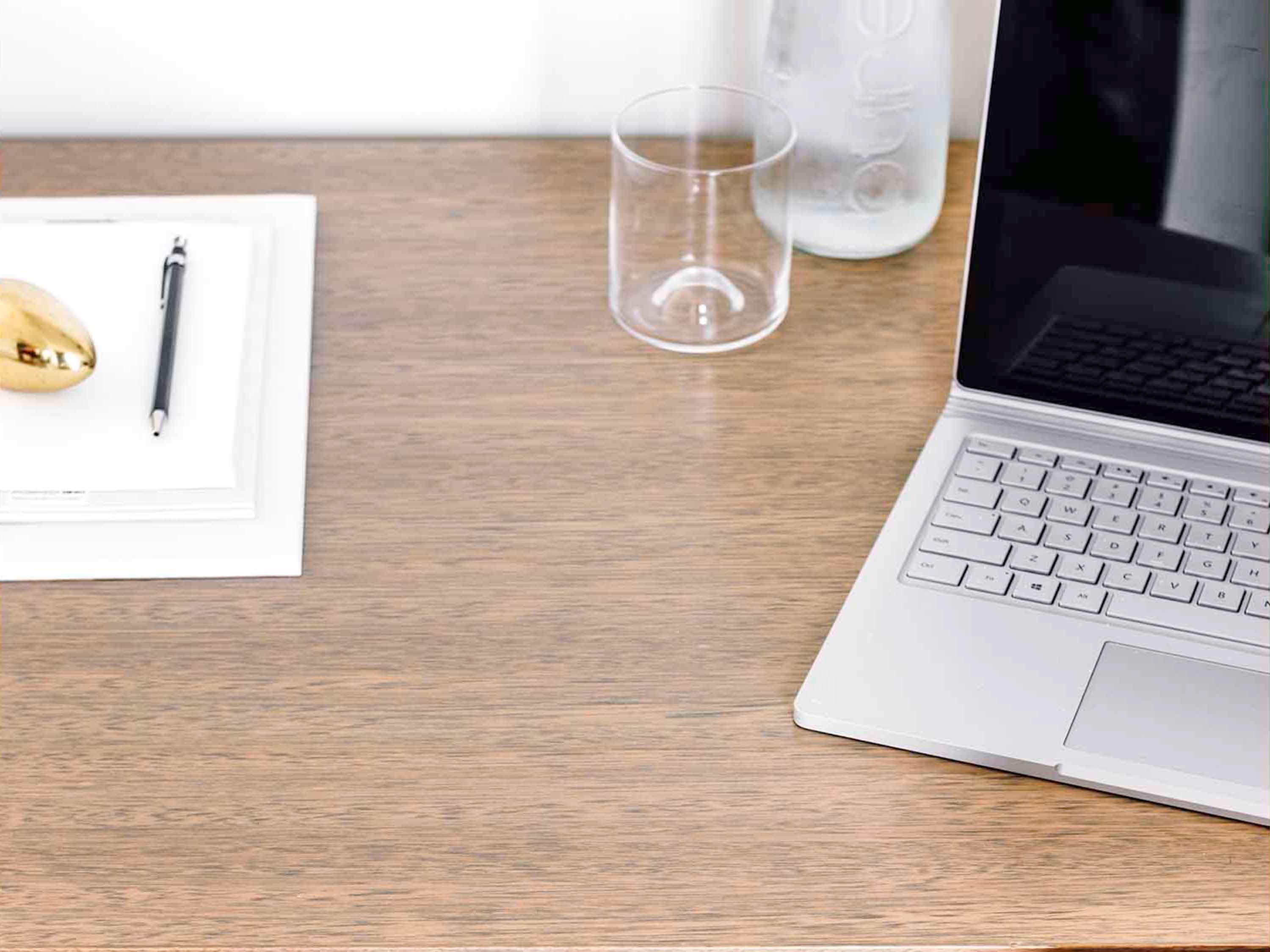 The Como Melbourne Bagian luar foto A desk with a laptop and a notebook