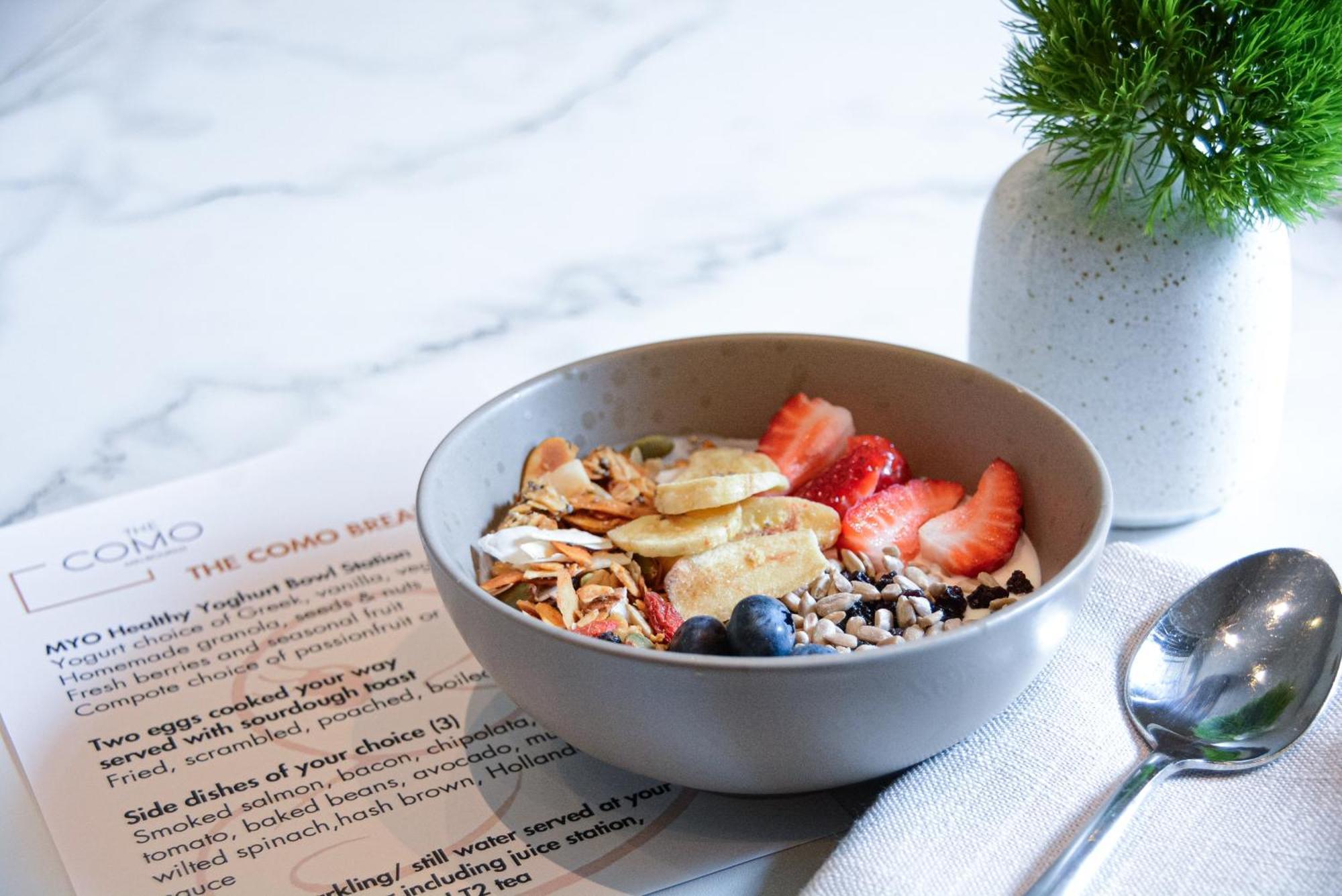 The Como Melbourne Bagian luar foto A bowl of granola with fruit